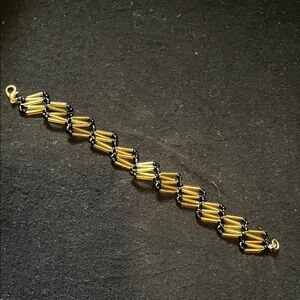 Elegant Gold and Black Bracelet